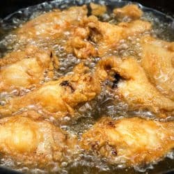 Chicken wing deep fried on hot vegetable palm oil, Can You Reuse Oil After Frying Raw Chicken?