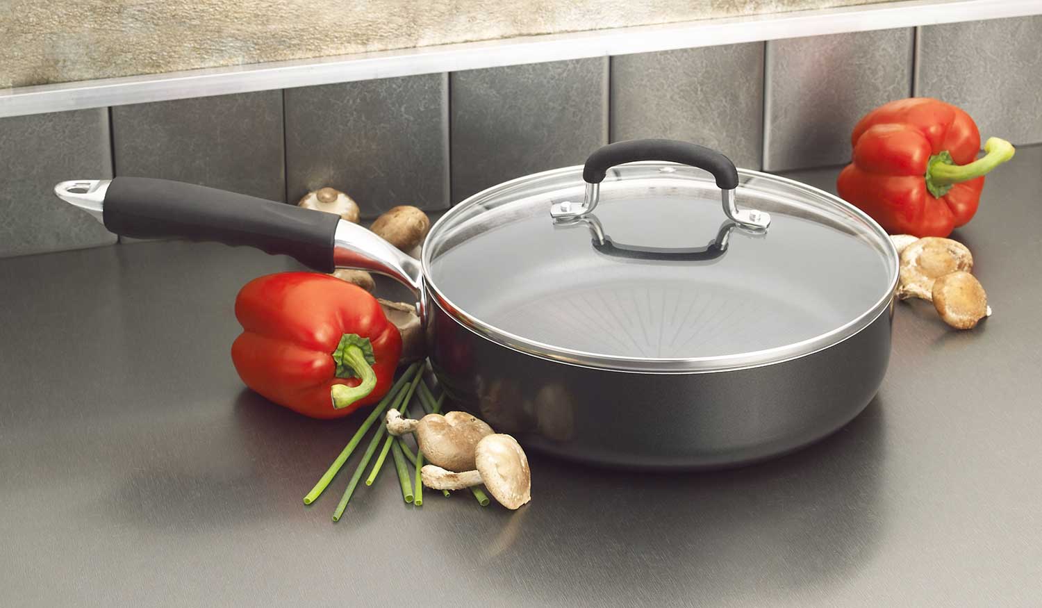 Nonstick saute pan with glass lid on kitchen counter