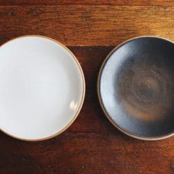 Black and brown bowl placed on wooden table, How Big Should A Serving Bowl Be?