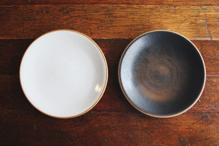 Black and brown bowl placed on wooden table, How Big Should A Serving Bowl Be?