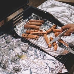 Man cooking hotdogs and placing them on aluminum foils, Easy Baking Paper Sheets Alternatives