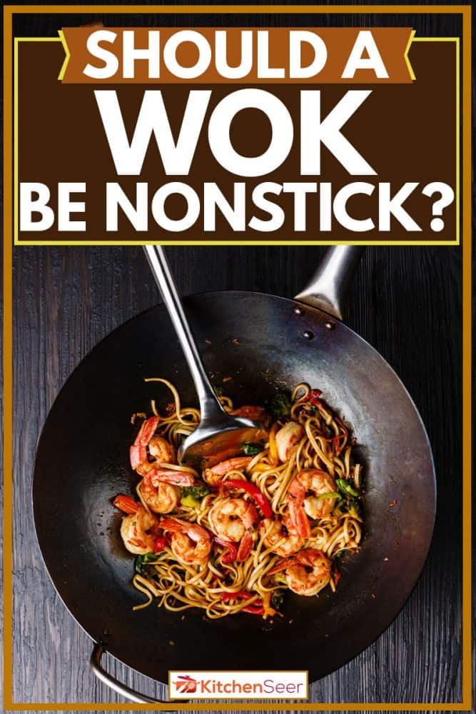 Stir fry udon with shrimps cooked on wok with spatula for mixing, Should A Wok Be Nonstick?