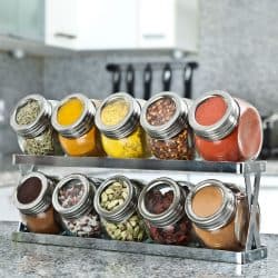 All sorts of spices placed on a spice rack for good display, 13 Unique Gifts For Cooking Enthusiasts
