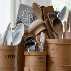 Kitchen utensils in containers on table, Kitchen Utensils: The Ultimate List [Do You Know All 56?]