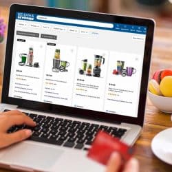 Person shopping online using a laptop holding a credit card, Where To Buy The NutriBullet [Top 25 Online Stores]