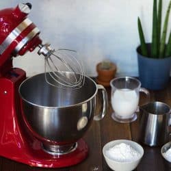 Red standing mixer with ingredients on the wooden table, KitchenAid Accessories For Your Stand Mixer