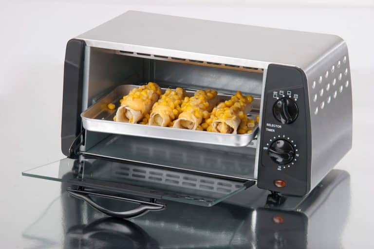 Toaster oven opened after toasting food, 10 Toaster Oven Accessories You Probably Need