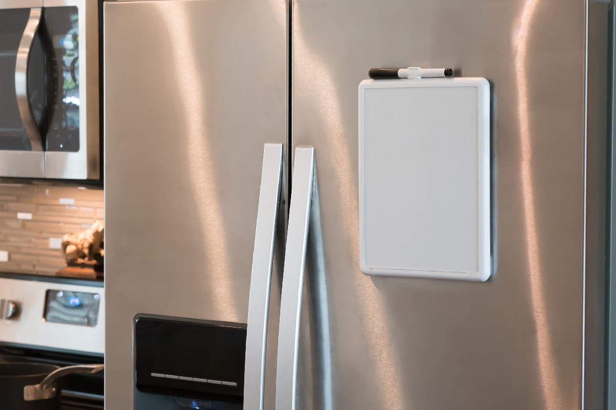Stainless steel refrigerator with a magnetic dry erase whiteboard