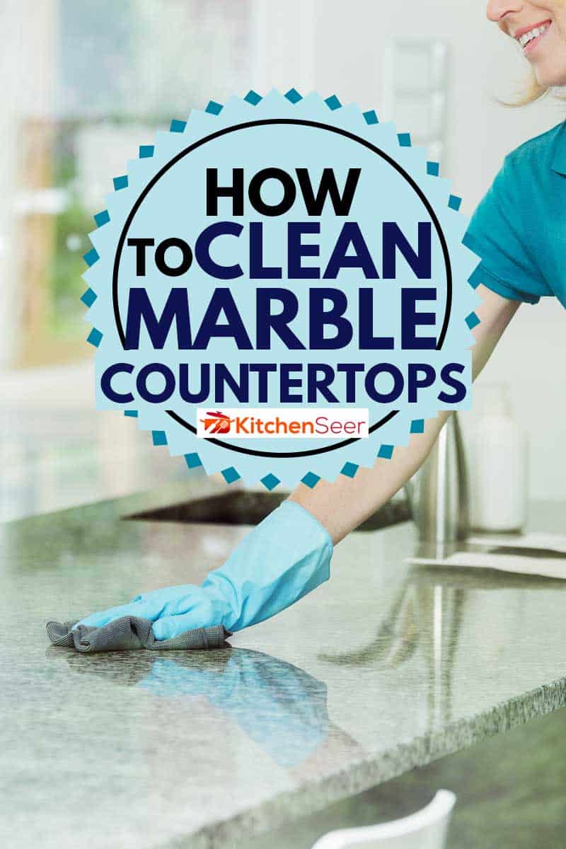 Professional house cleaning service concept, smiling woman wiping down marble kitchen countertop using domestic cleaner, cloth and rubber household gloves, How To Clean Marble Countertops?