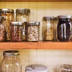 A pantry filled with spices and jars cooking ingredient inside, How to Organize a Pantry with Deep Shelves [6 Easy-to-follow Tips]