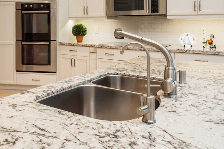 Beautiful home kitchen sink with granite countertops, Do Granite Countertops Need To Be Sealed [And How To Do That]