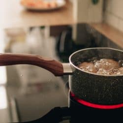 Eggs boiling on a pot placed over an Induction cooker, How Long Does It Take To Boil An Egg On An Induction Stove?