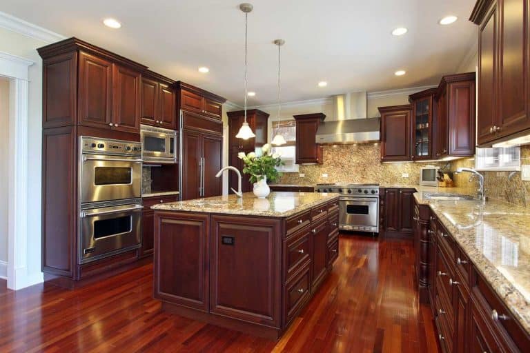 Kitchen with cherry wood cabinetry, Are Kitchen Cabinets Considered Furniture or Fixtures