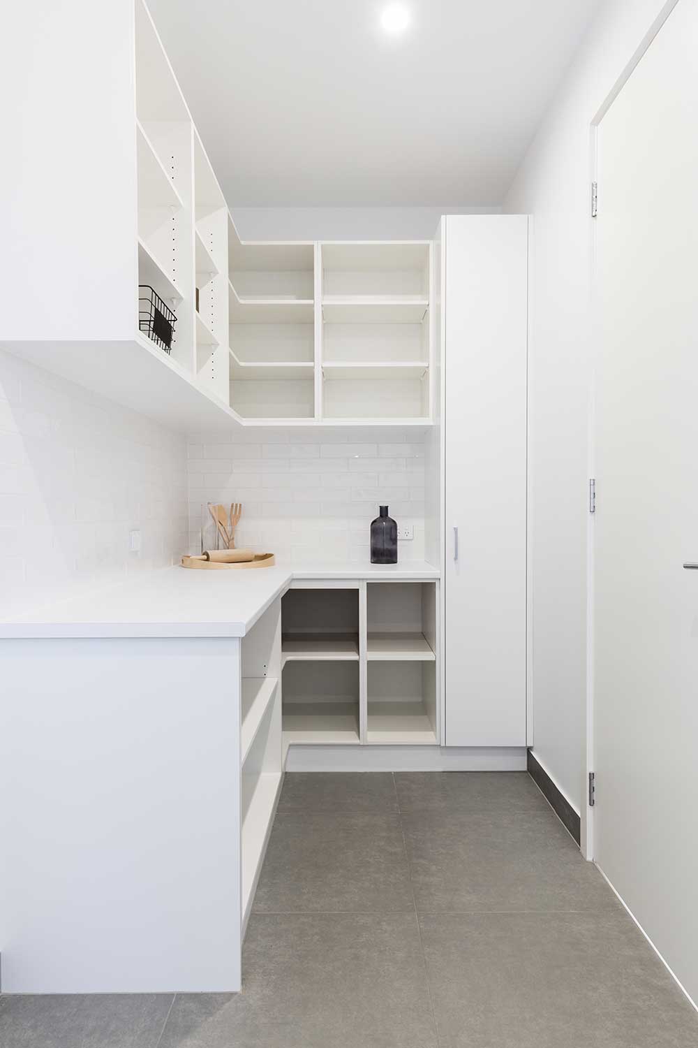 Large walk-in butlers pantry storage area in a new home