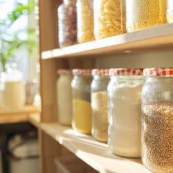 A pantry with jar filled with different ingredients and spices for cooking, How To Get Rid Of Pantry Bugs Naturally [5 Crucial Tips]