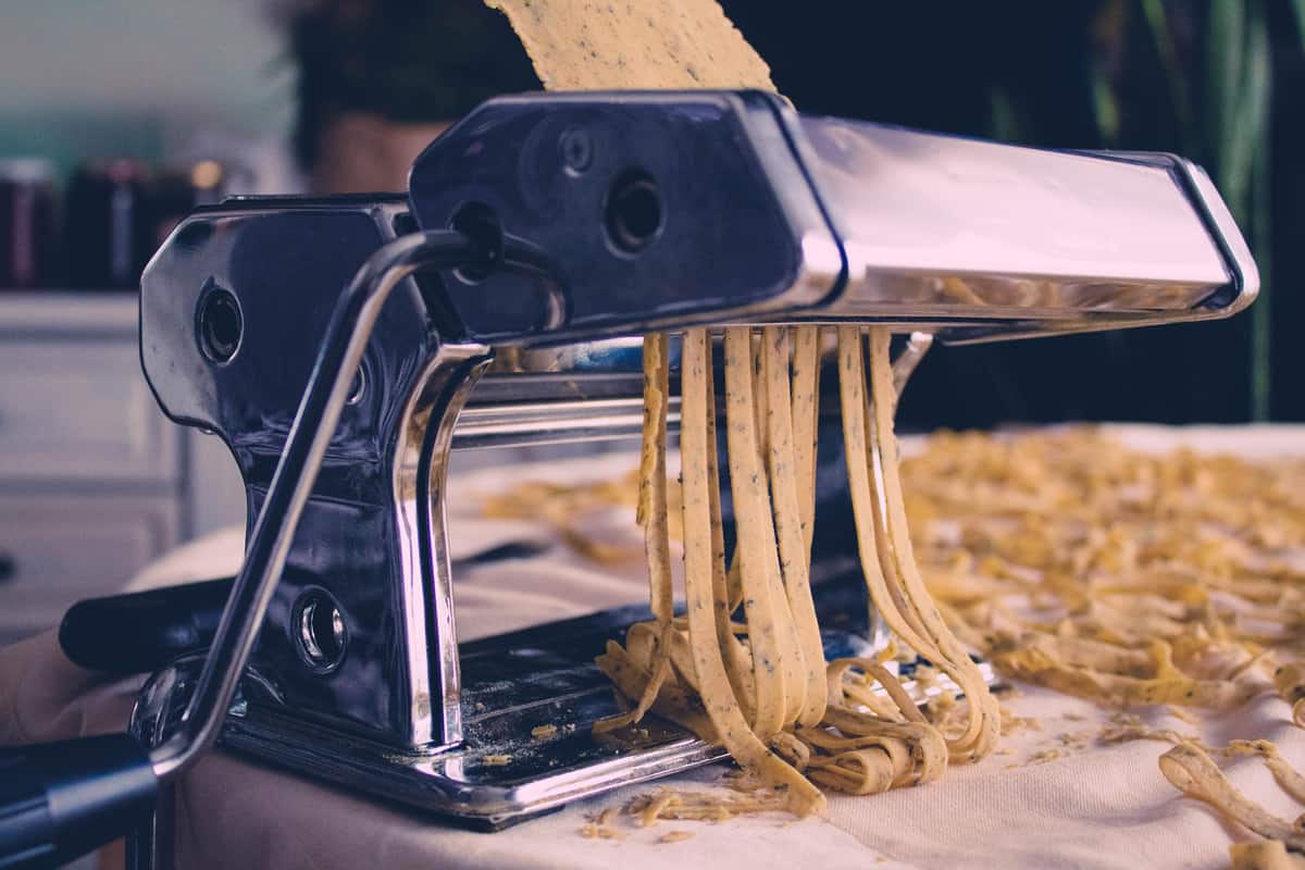 A pasta machine slicing a whole pasta into tiny strips, How To Sharpen A Pasta Machine