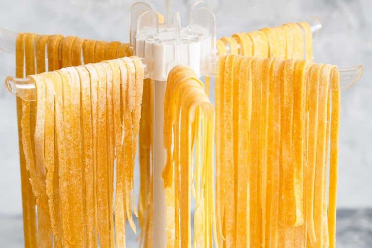 Homemade pasta linguine hanging on rack to dry, Do You Need A Pasta Drying Rack? [Here are some alternatives]