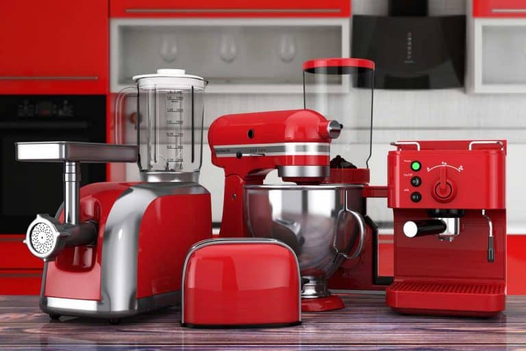 Kitchen Appliances Set. Red Blender, Toaster, Coffee Machine, Meat Ginder, Food Mixer and Coffee Grinder on a wooden table, Can You Put Hot Things In A Food Processor?