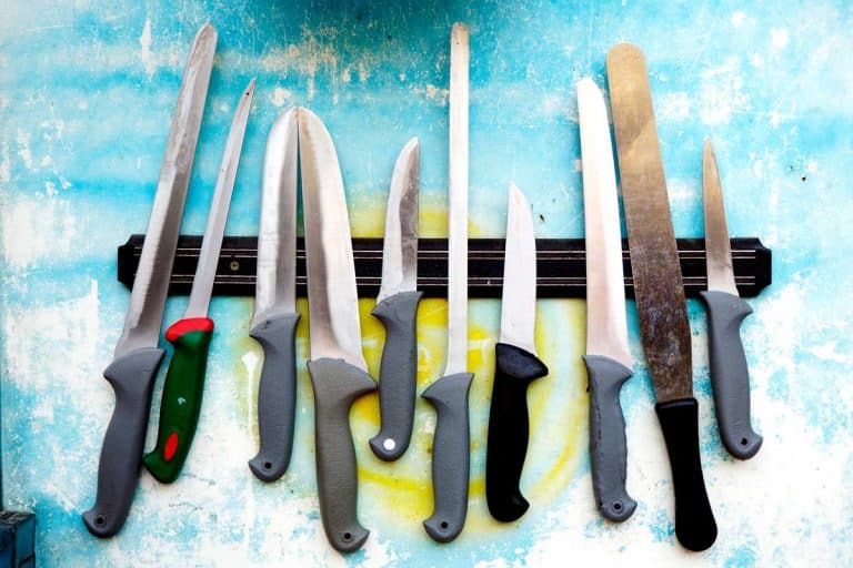 Knives on a magnetic holder row, How To Store a Chef Knife? [3 Must-See Locations]