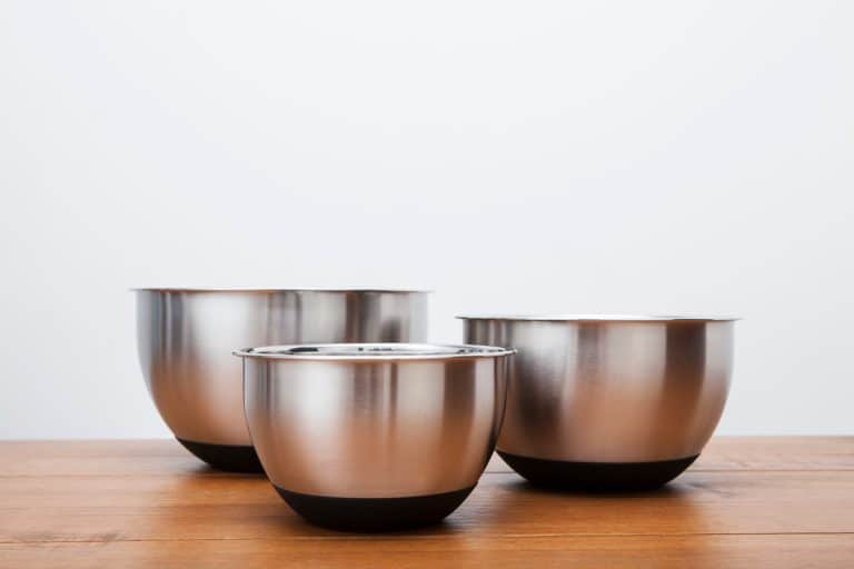 Three different sized mixing bowls on a wooden table, Are Stainless Steel Mixing Bowls Oven-Safe?