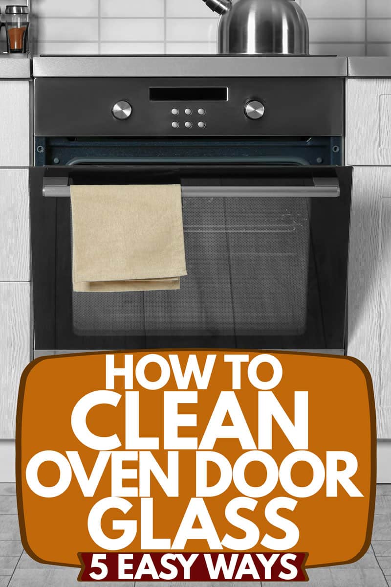 A modern kitchen interior with a spice rack on the top and an oven with a cloth on the handle, How to Clean Oven Door Glass [5 EASY ways]