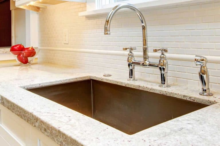 Large deep metal kitchen sink with granite countertops, Granite Refinishing - How To Get Countertops To Shine Again?