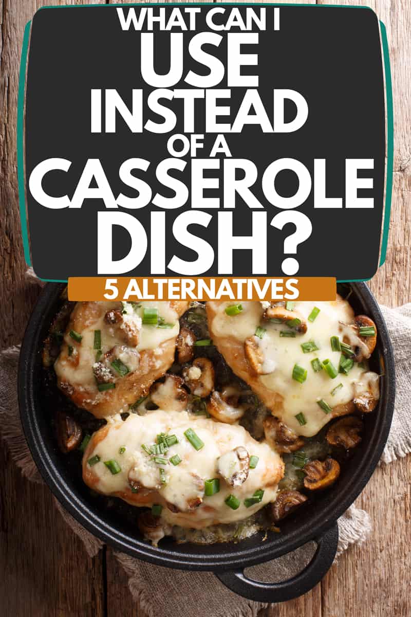 A dish cooked inside a black casserole placed on a wooden table, What Can I Use Instead Of A Casserole Dish? (5 Alternatives)