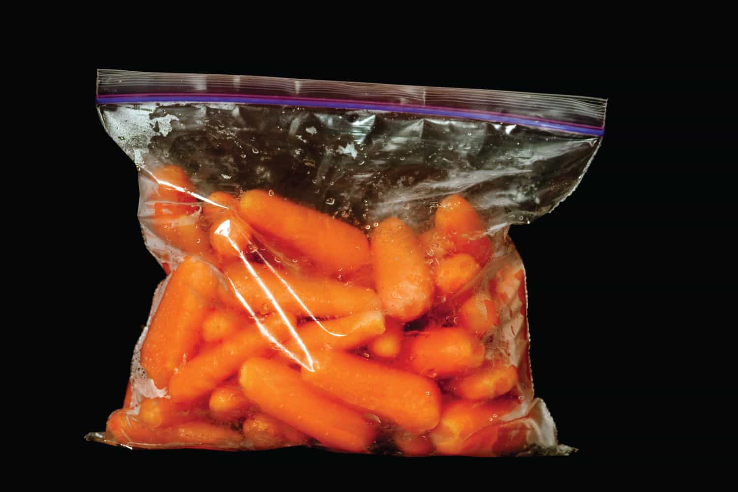 A ziplock bag full of baby carrots