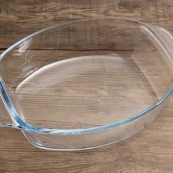 Empty glass casserole pan on a rustic wooden surface, How Deep Should A Casserole Dish Be?