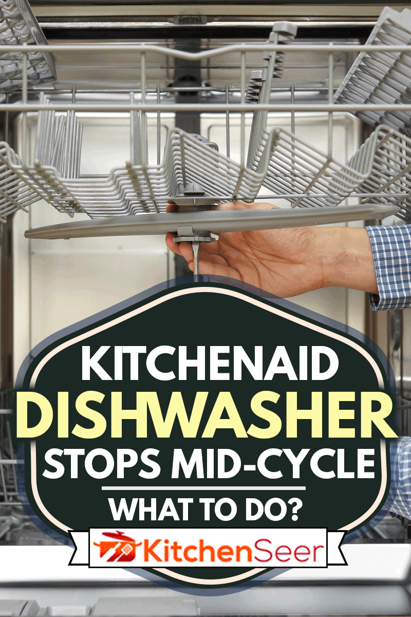 Handyman repairing a dishwasher, KitchenAid Dishwasher Stops Mid-Cycle - What To Do?