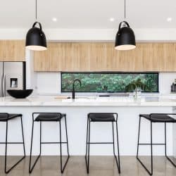Large white luxury Australian kitchen with marble waterfall island, Where To Put Outlets In A Waterfall Island