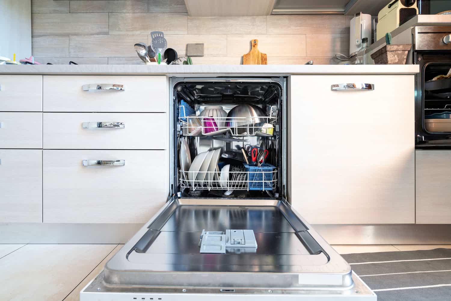 Opened dishwasher with clean dishes, KitchenAid Dishwasher Not Drying - What To Do?