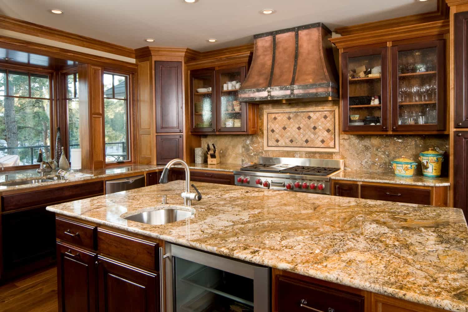 This modern kitchen has a granite counter island