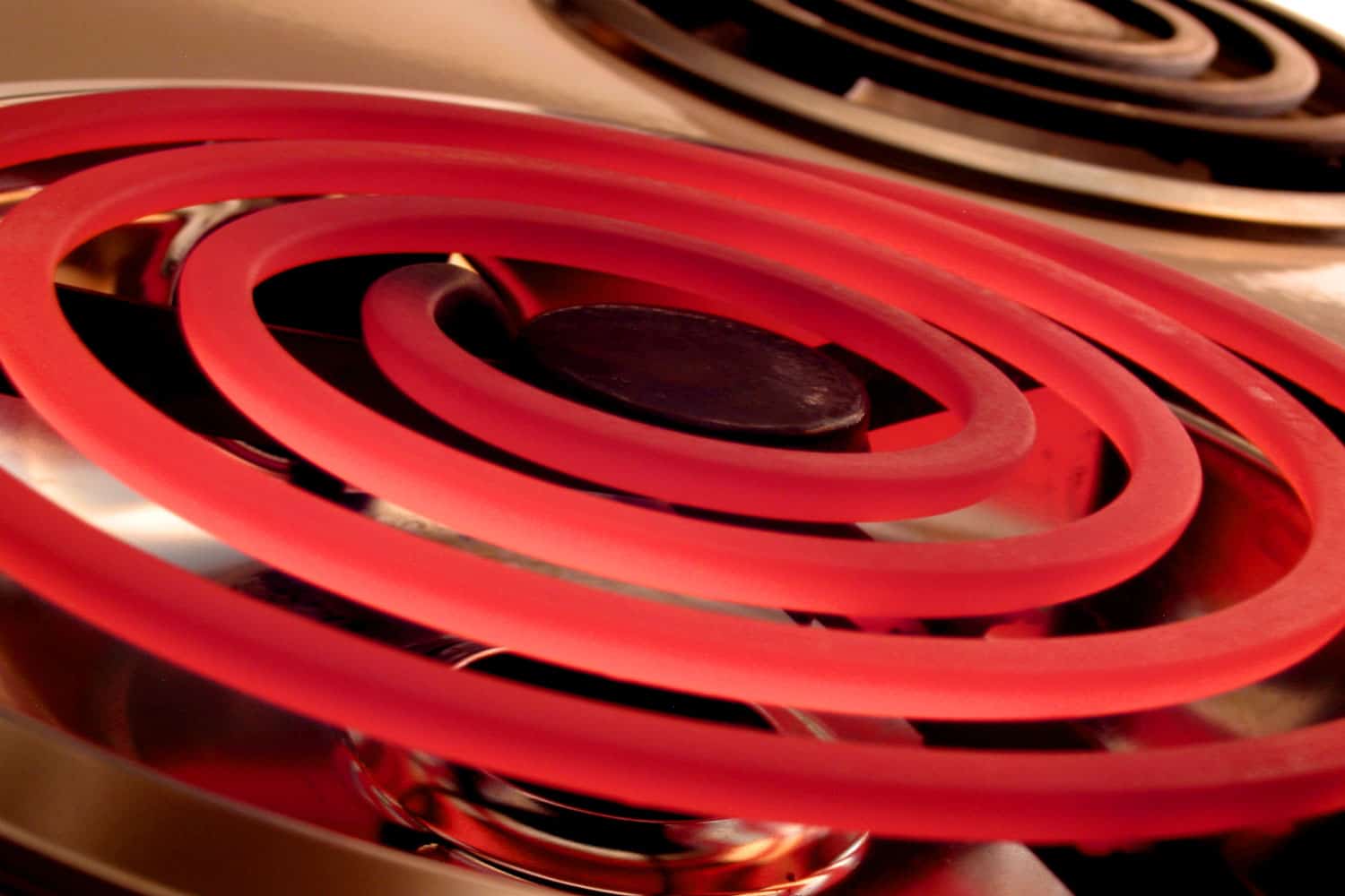 Macro shot of a glowing red electric burner 