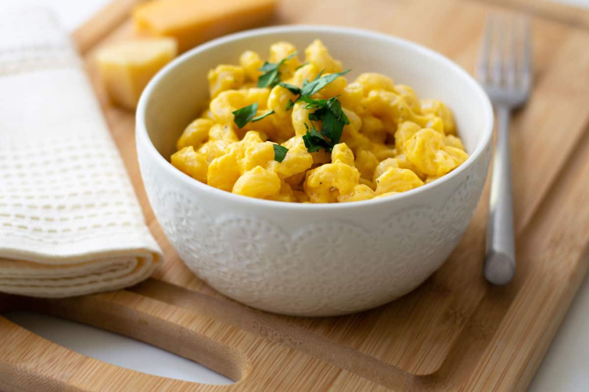 Macaroni and Cheese American comfort food placed on top of a chopping board
