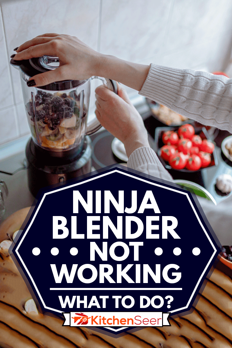Woman making healthy and tasty smoothies from various fruits and vegetables in the electric blender in the kitchen at home, Ninja Blender Not Working - What To Do?