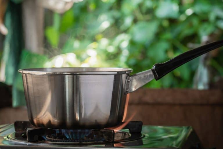 steel saucepan on the gas stove with burning in kitchen, Can You Boil Water In A Saucepan