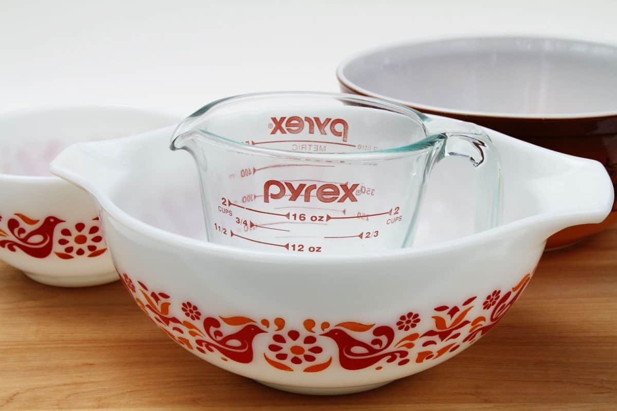 A Pyrex measuring glass inside a plastic mixing bowl
