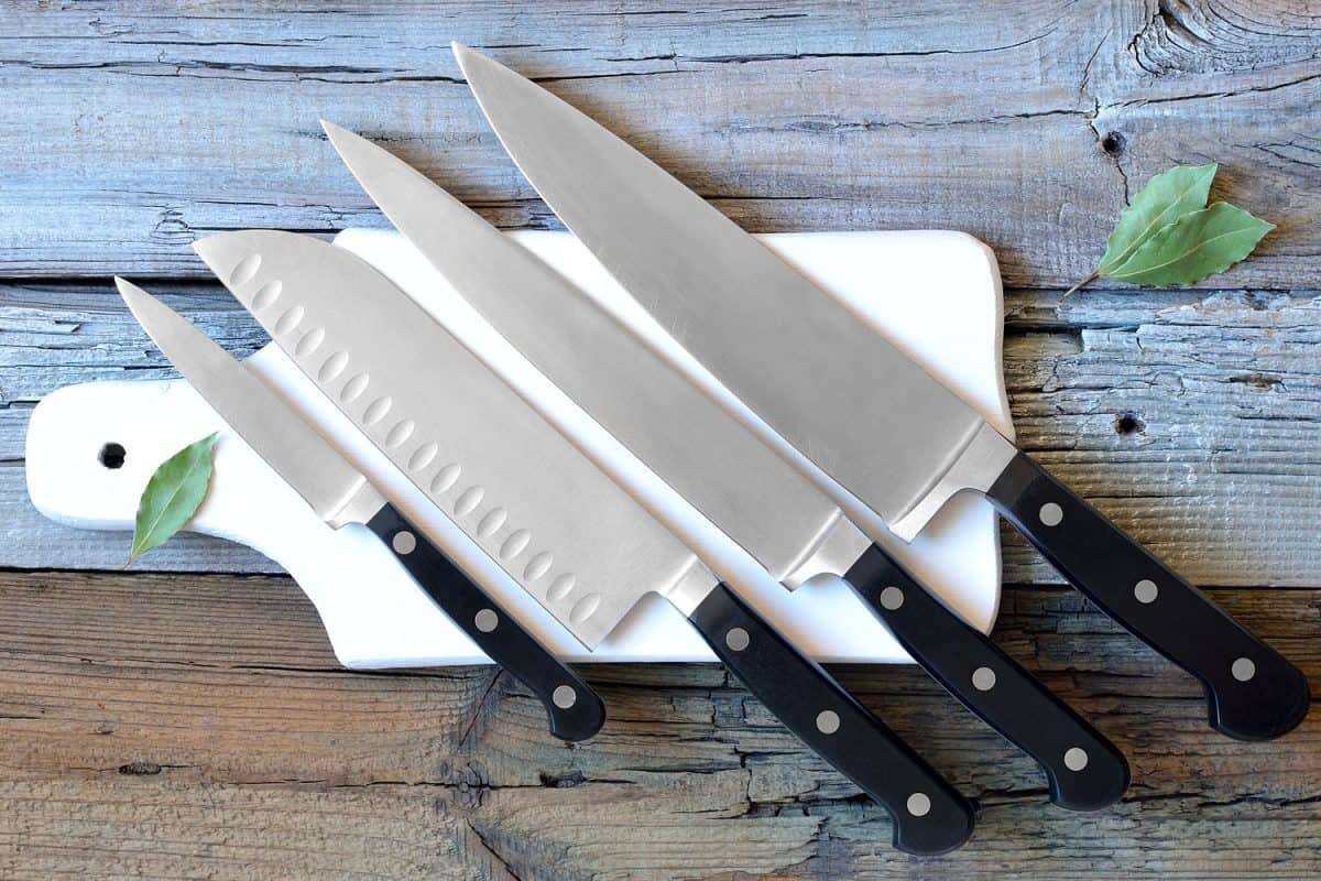 A set of cutting knives on a chopping board