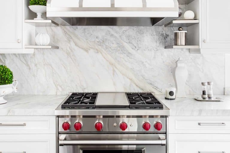 Bright classic white kitchen with gas range and marble backsplash, How Wide Should The Gap Be Between Slide-In Stove And Wall?