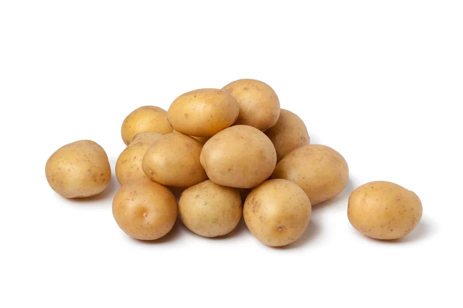 Small new potatoes on white background