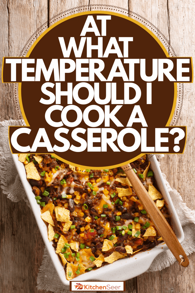 Freshly baked frito pie dish on a white ceramic casserole placed on a wooden table, At What Temperature Should I Cook a Casserole?