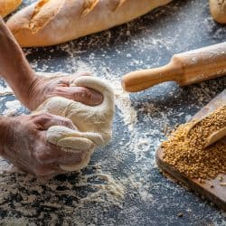 Baker man hands breadmaking kneading bread dough, How Long To Knead Bread [By Hand And In A Mixer]