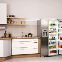 Big kitchen in a modern home with refrigerator and cabinets, What Is The Average Volume Of A Standard Fridge?