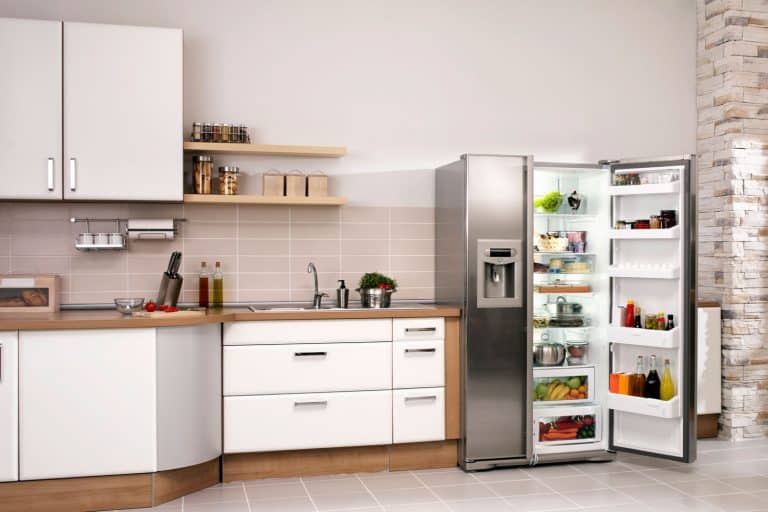 Big kitchen in a modern home with refrigerator and cabinets, What Is The Average Volume Of A Standard Fridge?