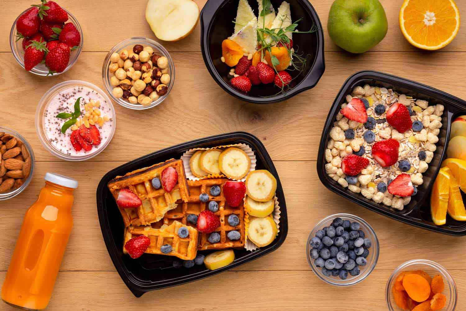 Organic breakfast meal delivery in plastic containers, top view
