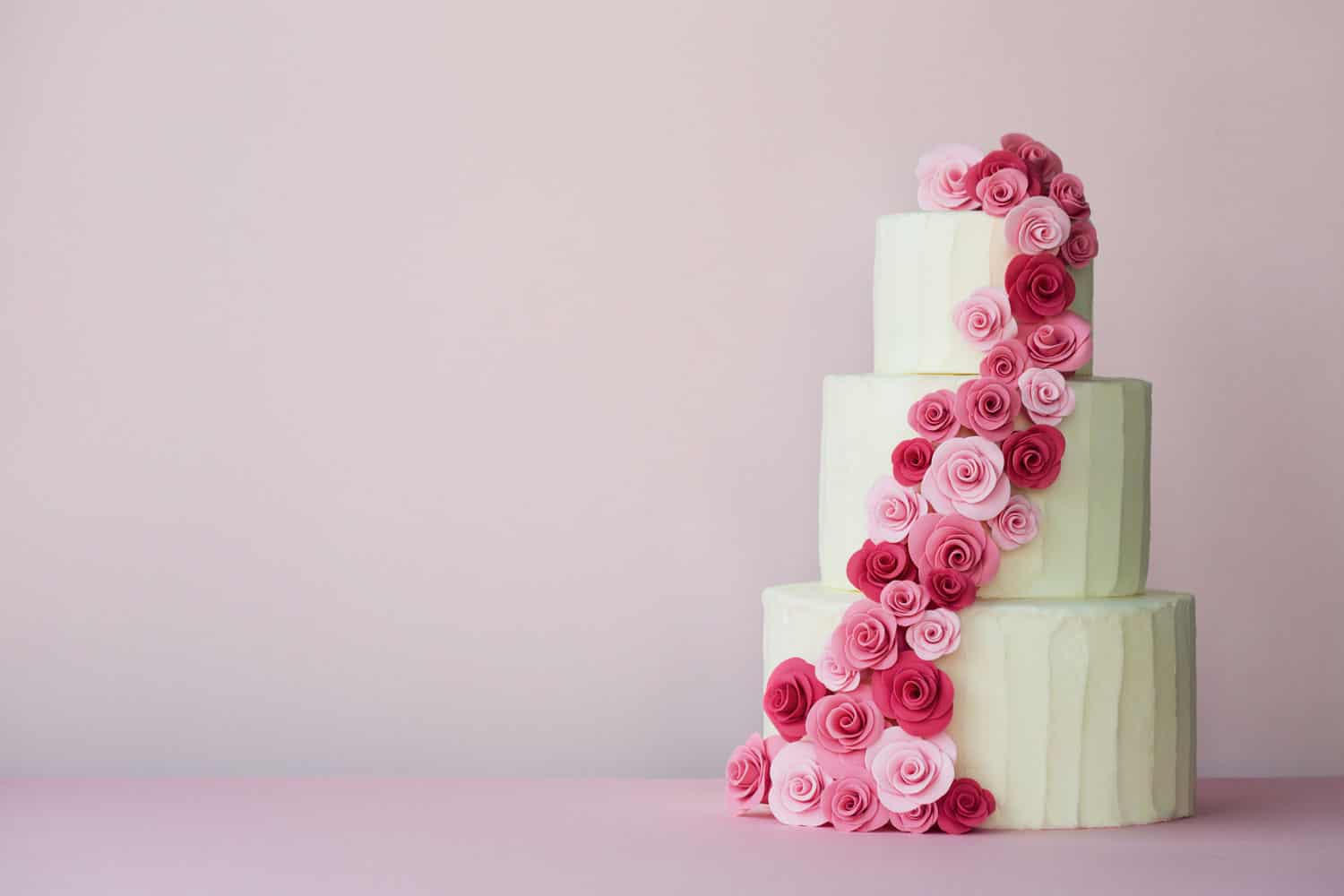 Tiered wedding cake with sugarpaste roses in pink