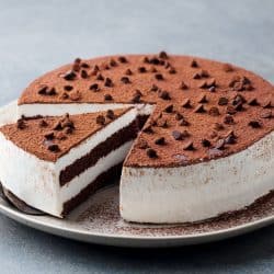 Tiramisu cake with chocolate decoration on a plate, How To Store Warm Cake Overnight