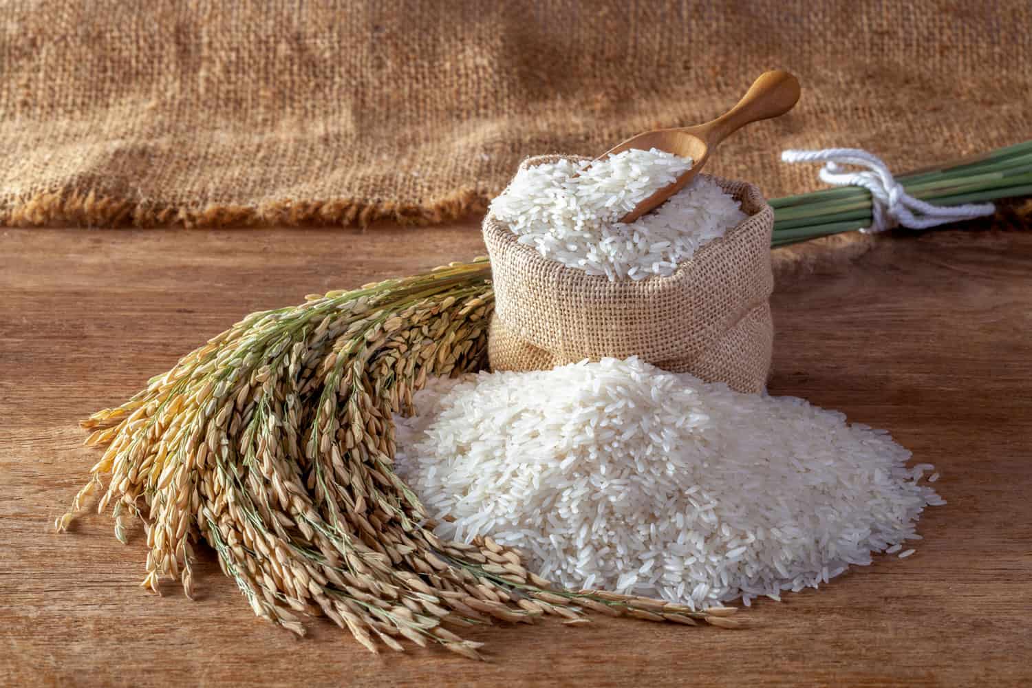 White rice (jasmine rice) in a sack on a wooden background, 6 Ways To Strain Rice Without A Strainer