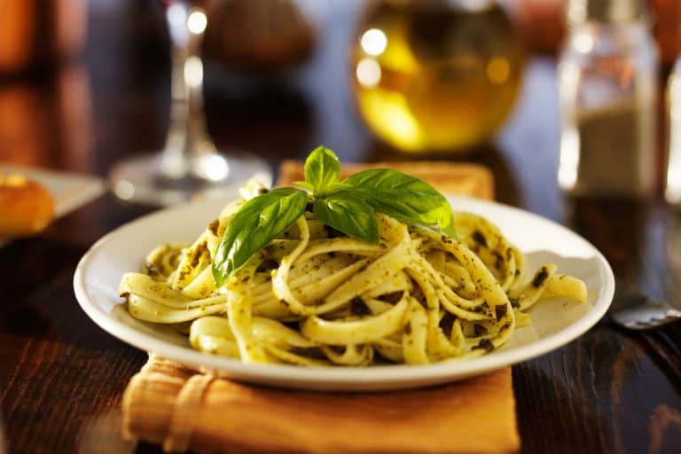 A delicious fettucine dish with bay leaves on top, How Long To Cook Noodles By Type